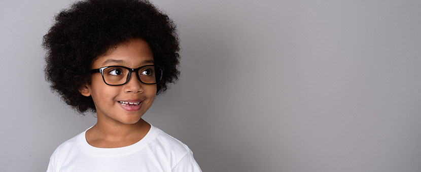 Cute african american girl with glasses smiling